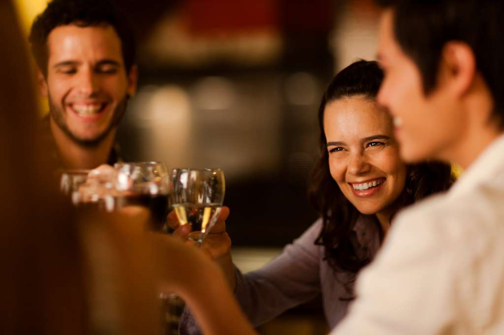 Group of friends toasting with wine