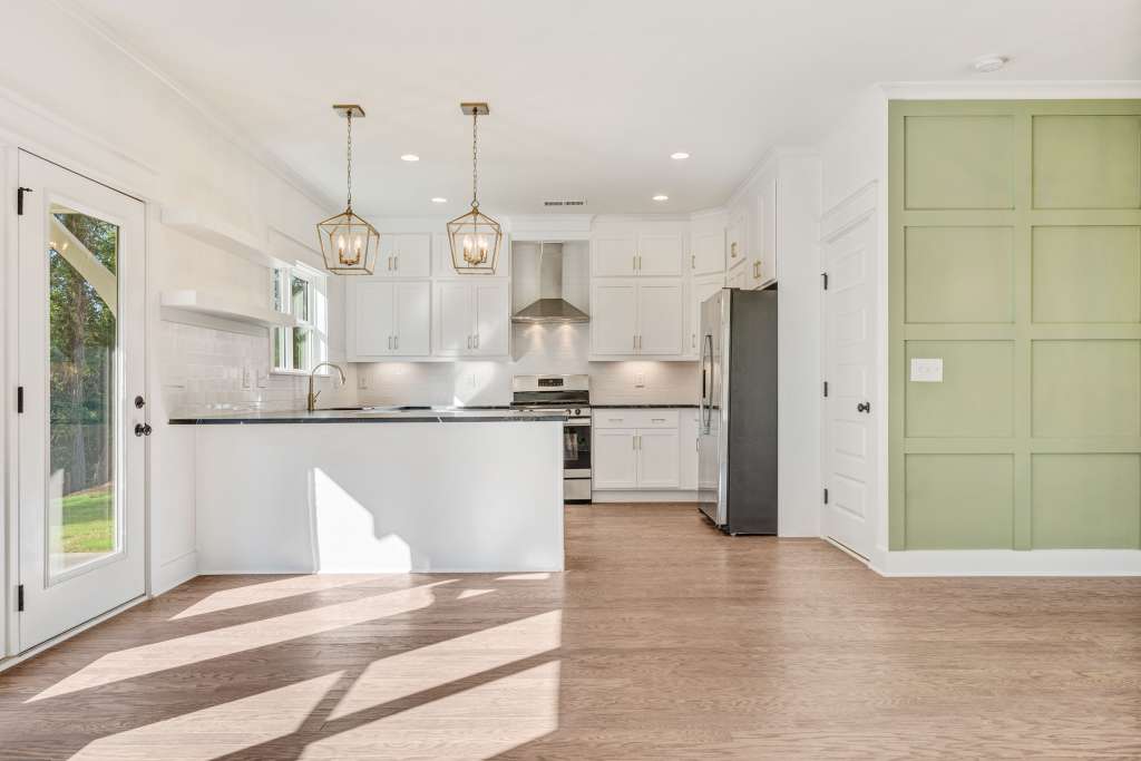 The open concept kitchen and dining in Oxmoor Grove